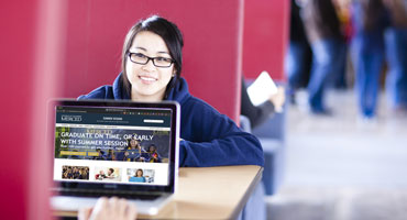 UC Merced student reviewing Summer Session website
